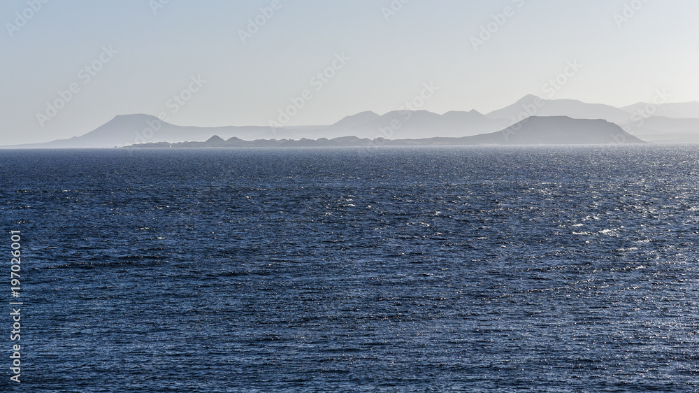Atlantic Ocean with a view of the Canary Islands in the background. Atlantic Ocean with a view of the Canary Islands in the background.