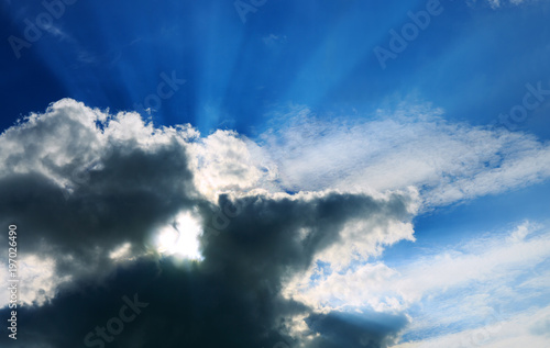 Sunshine on a gray sky and Heart shaped cloud.