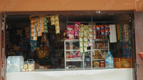 GALLE, SRI LANKA - JANUARY 2018: Indian street vendor with fresh vegetables and fruits along the road tourist backpack photo