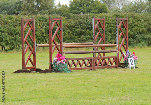 A Traditional Wooden Horse Jump with Round Bars.
