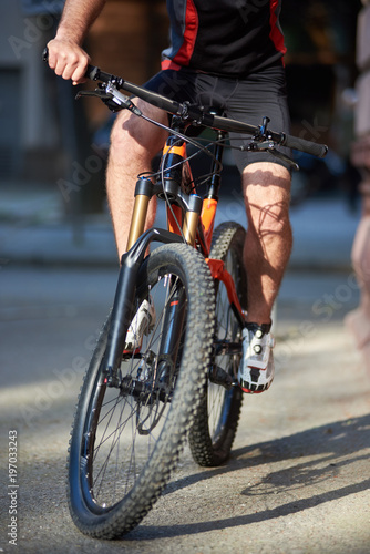 Close up of professional bicycle with cyclist riding it. Concept of healthy lifestyle  outdoor activities  sport equipment