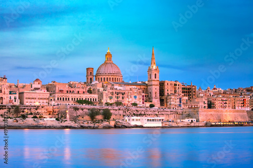 Valletta Skyline at beautiful sunset from Sliema with churches of Our Lady of Mount Carmel and St. Paul's Anglican Pro-Cathedral, Valletta, Capital city of Malta © Kavalenkava