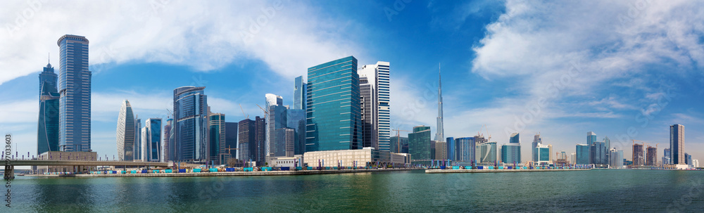 DUBAI, UAE - MARCH 29, 2017: The panorama with the new Canal and skyscrapers of Downtown.