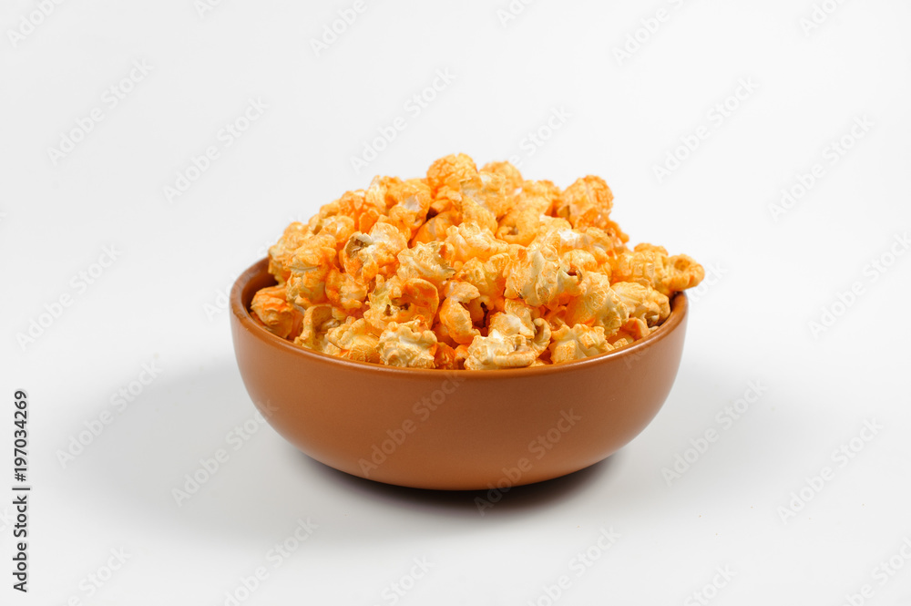 Brown deep plated filled with fresh salty popcorn Brown deep plated filled with fresh salty popcorn