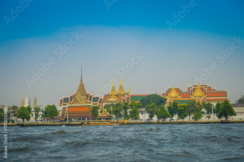 Outdoor view of Wat Pho or Wat Phra Chetuphon, 'Wat' means temple in Thai located in the horzont. The temple is one of Bangkok's most famous tourist sites in Thailand