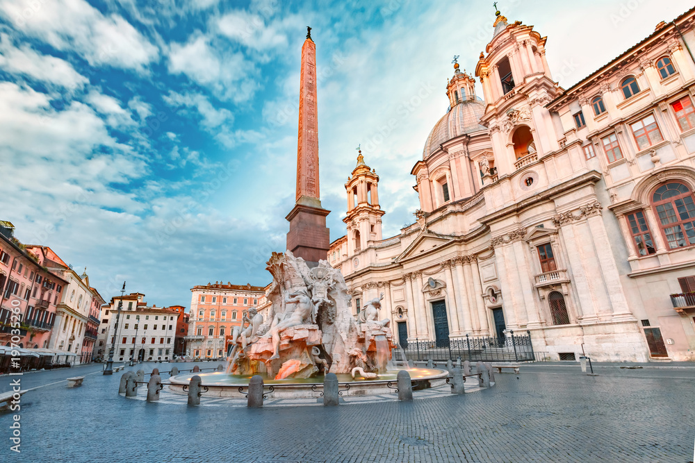 Fototapeta premium Fountain of the Four Rivers with an Egyptian obelisk and Sant Agnese Church on the famous Piazza Navona Square in the morning, Rome, Italy.