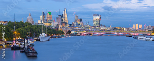 London - The evening panorama of the City with the skyscrapers in the center and Canary Wharf in the background.