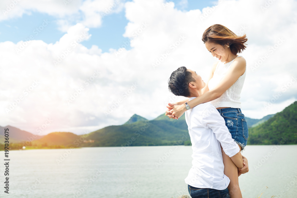 Women lovers are carry body on under blue sky and smile with the best moment between travel.
