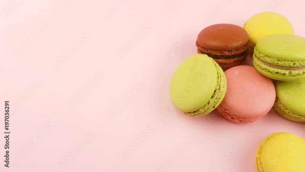 Macaroons or macaron on pastel pink surface. Close up macro. Macaroons or macaron on pastel pink surface. Close up macro.
