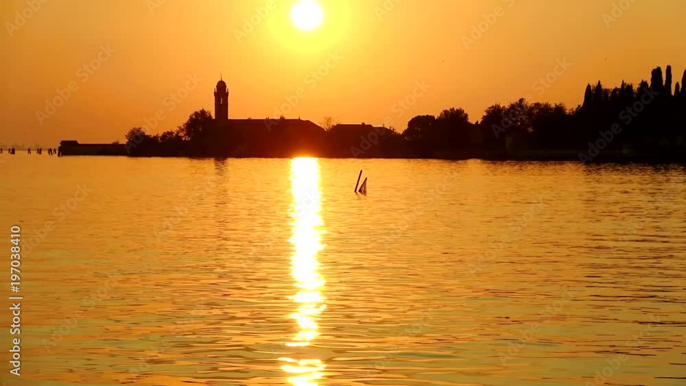 Orange sunset over the island of Mazzorbo. Venetian lagoon, Italy (timelapse) Orange sunset over the island of Mazzorbo. Venetian lagoon, Italy (timelapse)