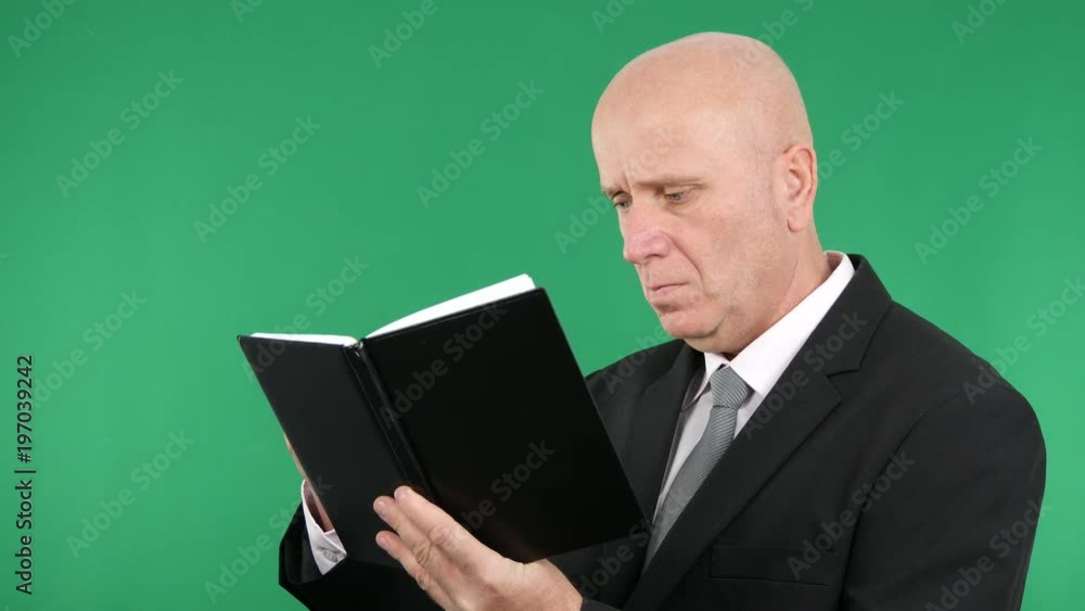 Confident Businessperson Write in Agenda Using a Pen Confident Businessperson Write in Agenda Using a Pen