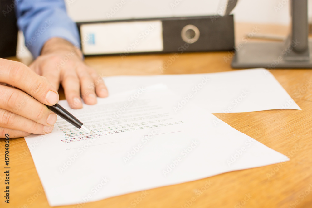 Please sign here - men showing contract to customer Please sign here - men showing contract to customer