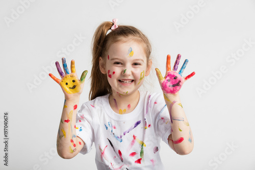 Young kid showing her colorful hands