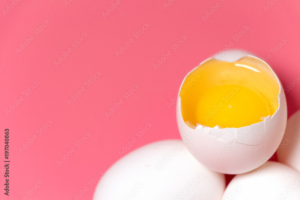 Cracked egg with white and yolk over pink. Minimal Easter concept. Top  view. White eggs on pink background. Close up. Copy space. Flat lay. Stock  Photo | Adobe Stock