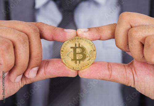 bitcoin in hand of business man