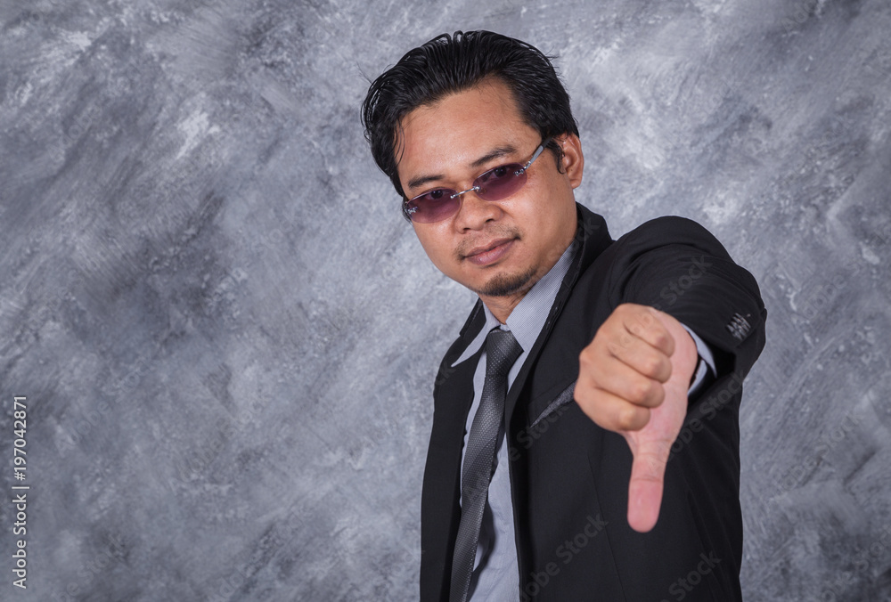 business man in suit with thumb down business man in suit with thumb down