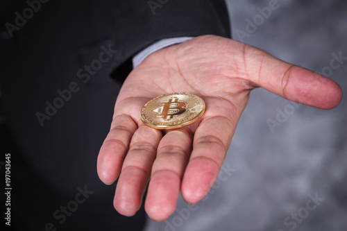 bitcoin in hand of business man