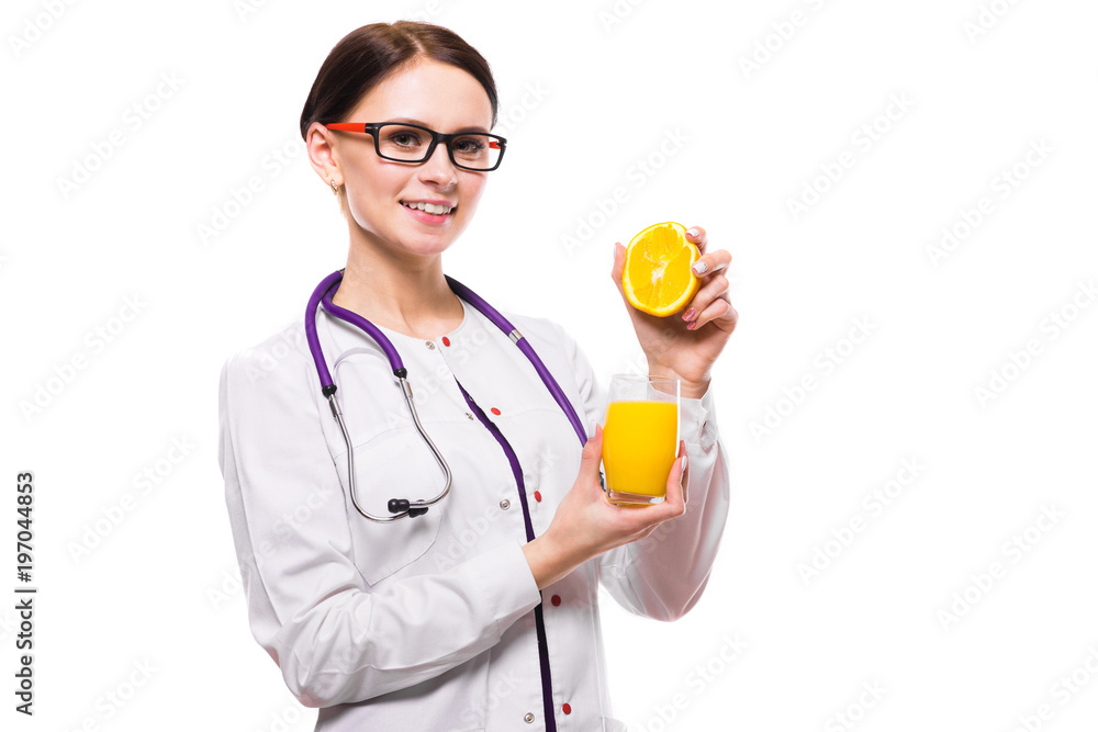 Female nutritionist hold orange in section and glass of fresh juice in her hands on white background Female nutritionist hold orange in section and glass of fresh juice in her hands on white background