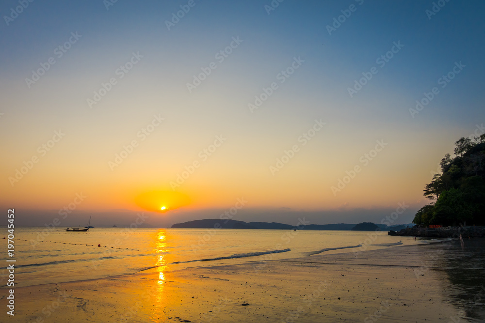 Beautiful outdoor view of AO Nang beach during a sunset at Krabi Province, Andaman Sea, South of Thailand Beautiful outdoor view of AO Nang beach during a sunset at Krabi Province, Andaman Sea, South of Thailand
