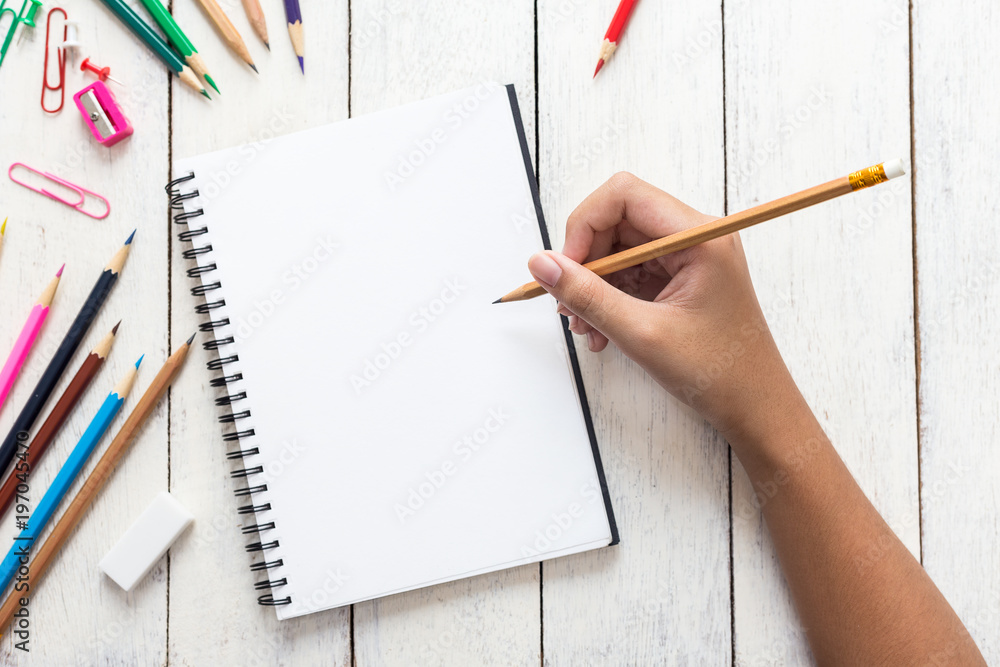 Girl hand drawing, blank paper and colorful pencils on white wooden table  Stock Photo | Adobe Stock