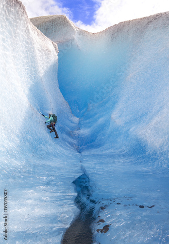 Woman climbing Mendenhall Glacier photo