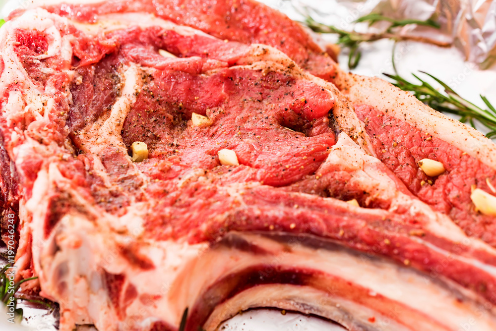 Close up seasoned beef steak stuffed with garlic Close up seasoned beef steak stuffed with garlic