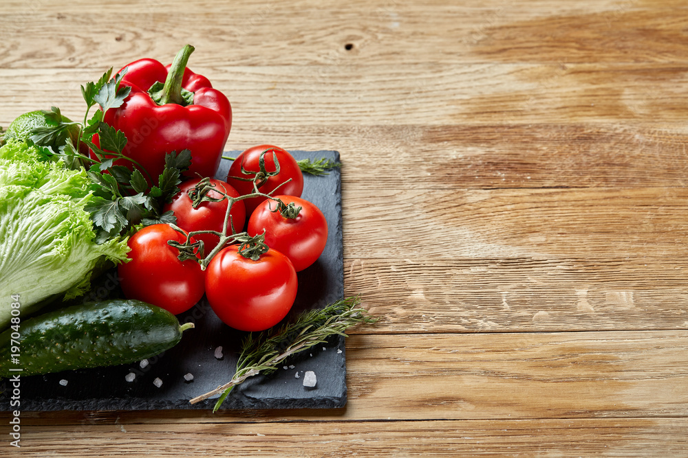 Organic closeup still life of assorted fresh vegetables and herbs on rustic wooden background, topview, selective focus. Organic closeup still life of assorted fresh vegetables and herbs on rustic wooden background, topview, selective focus.