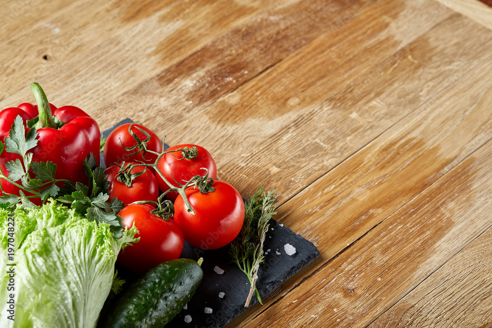 Organic closeup still life of assorted fresh vegetables and herbs on rustic wooden background, topview, selective focus. Organic closeup still life of assorted fresh vegetables and herbs on rustic wooden background, topview, selective focus.