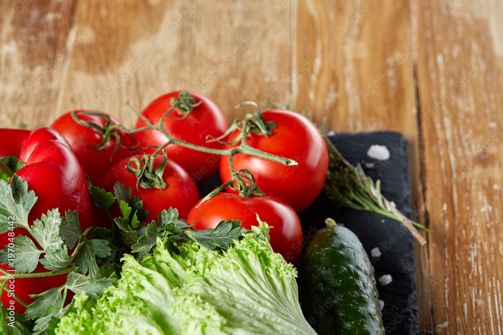 Organic closeup still life of assorted fresh vegetables and herbs on rustic wooden background, topview, selective focus. Organic closeup still life of assorted fresh vegetables and herbs on rustic wooden background, topview, selective focus.