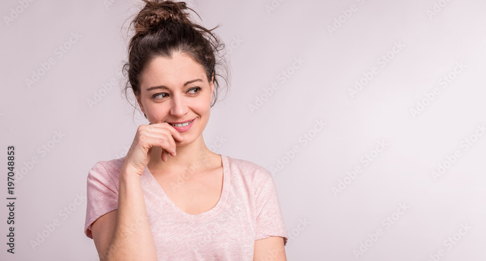 Portrait of a young beautiful woman in studio. Portrait of a young beautiful woman in studio.