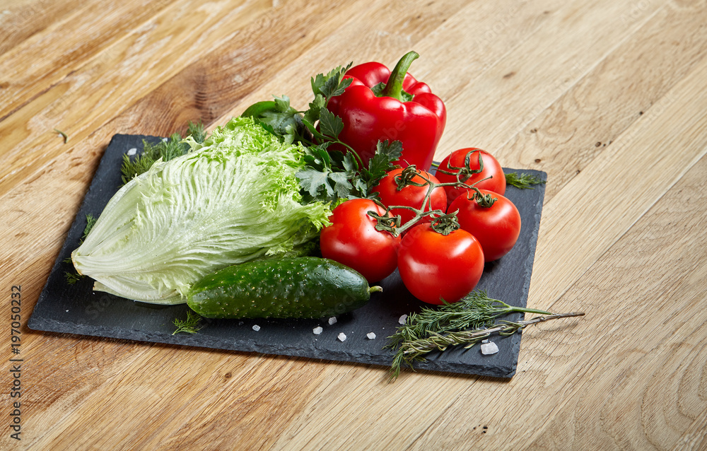 Organic closeup still life of assorted fresh vegetables and herbs on rustic wooden background, topview, selective focus. Organic closeup still life of assorted fresh vegetables and herbs on rustic wooden background, topview, selective focus.