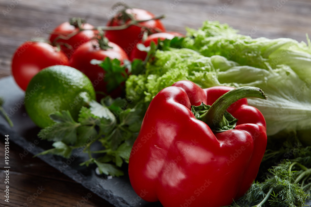 Close-up still life of assorted fresh vegetables and herbs on vintage wooden background, top view, selective focus. Close-up still life of assorted fresh vegetables and herbs on vintage wooden background, top view, selective focus.