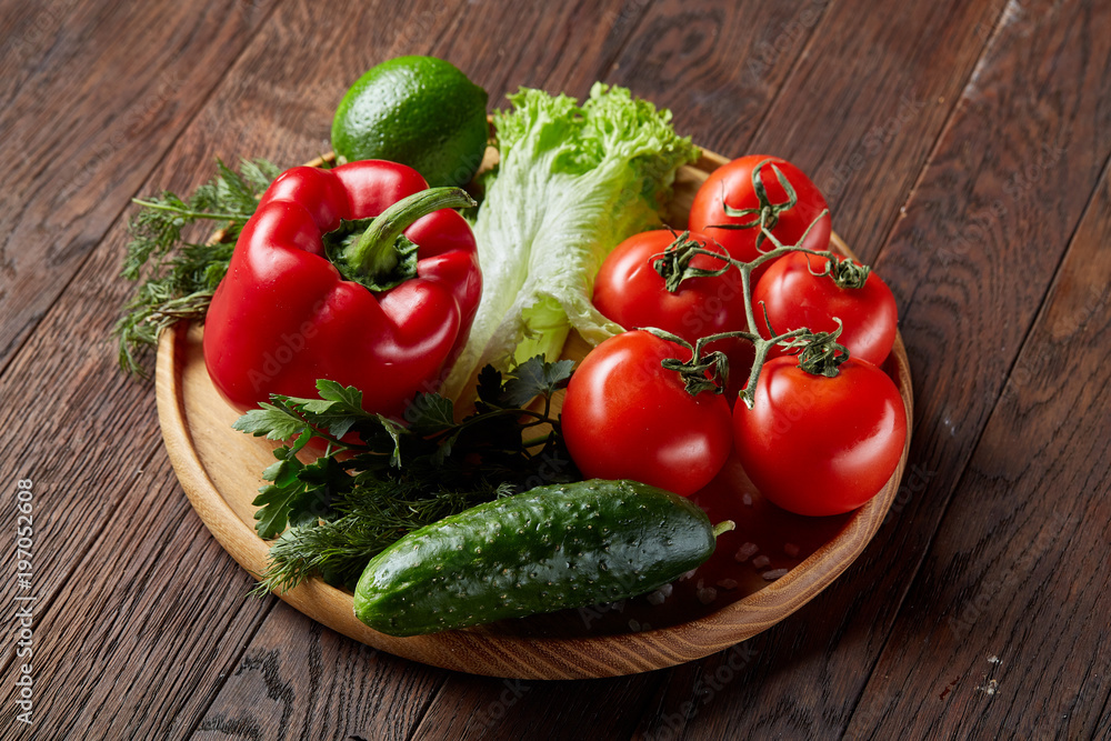 Close-up still life of assorted fresh vegetables and herbs on vintage wooden background, top view, selective focus. Close-up still life of assorted fresh vegetables and herbs on vintage wooden background, top view, selective focus.