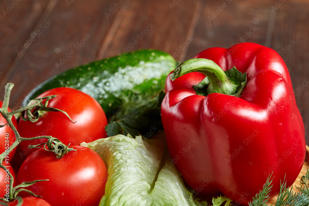 Close-up still life of assorted fresh vegetables and herbs on vintage wooden background, top view, selective focus. Close-up still life of assorted fresh vegetables and herbs on vintage wooden background, top view, selective focus.
