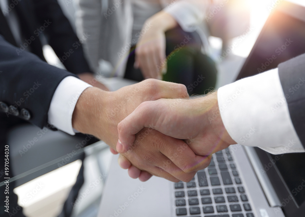 Two confidence businessman shaking hands close-up Two confidence businessman shaking hands close-up