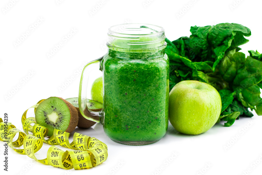 Green smoothie with spinach, apple, kiwi and mint isolated in a jar mug on white background Green smoothie with spinach, apple, kiwi and mint isolated in a jar mug on white background