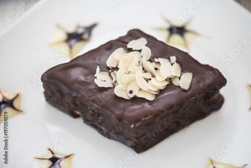 Chocolate cake on white pla...