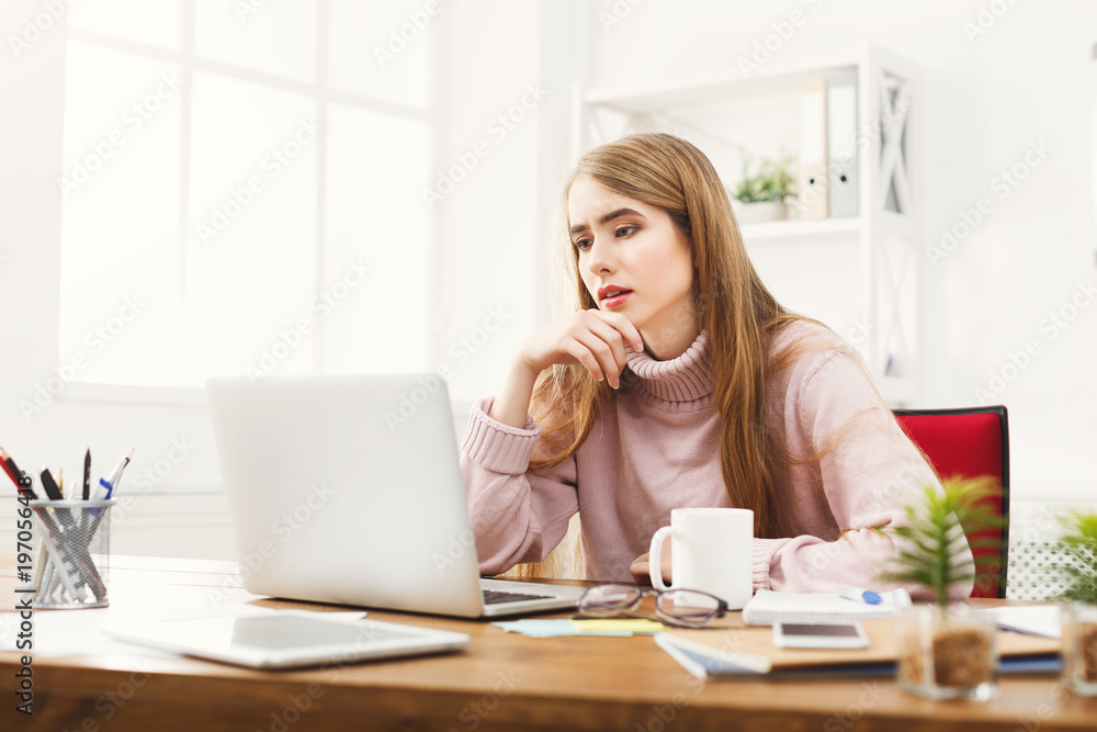 Business woman working on laptop at office Business woman working on laptop at office