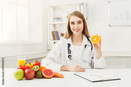Dietitian nutritionist with fresh orange