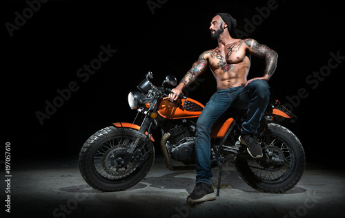 Stylish motorcycle chopper with exclusive man rider at night