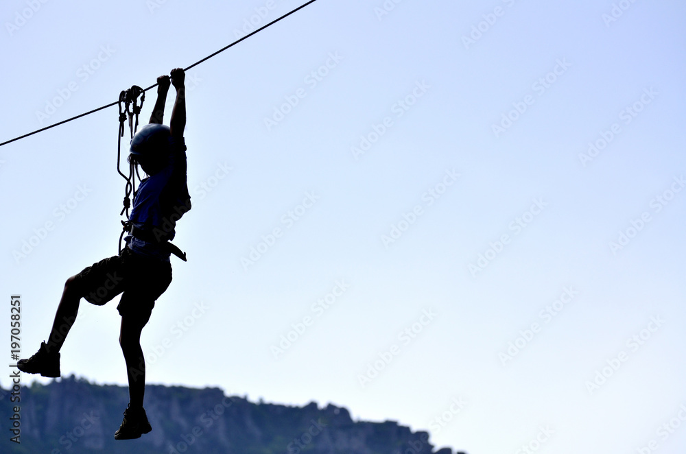 young woman hanging on a climbing rope young woman hanging on a climbing rope