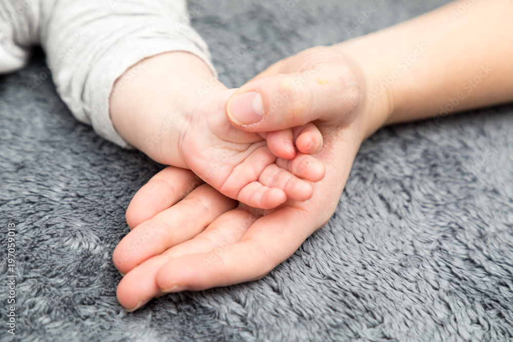 baby hand with mother hand