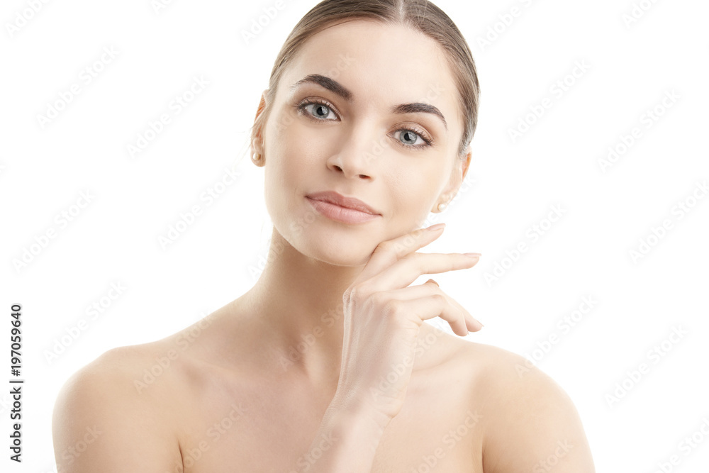 Healthy glowing skin. Portrait of beautiful young woman with toothy smile and radiant skin posing at isolated white background. Healthy glowing skin. Portrait of beautiful young woman with toothy smile and radiant skin posing at isolated white background.