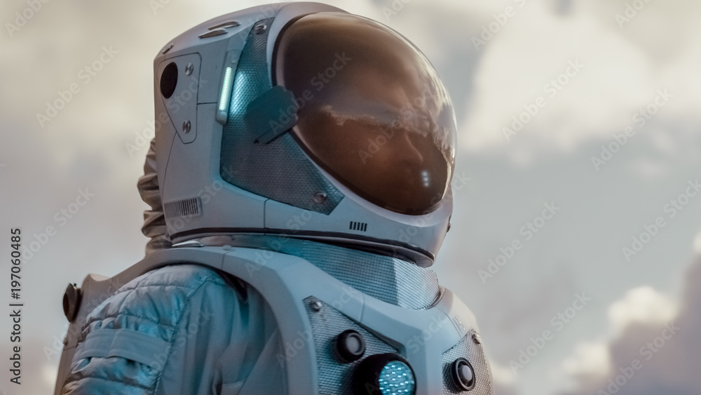 Shot of the Brave Astronaut in the Space Suit Looking Around Alien Planet. Blue and Cold Planet. Advanced Technologies, Space Travel, Colonization Concept.