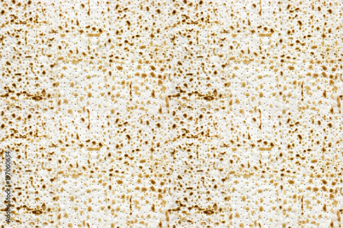 An overhead photo of matzah or matza. Seamless pattern. Matzah for the Jewish Passover holidays. Place for text, copy space. Selective soft focus.