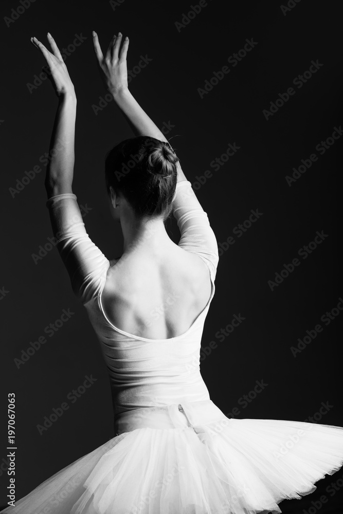 Fototapeta premium Young beautiful ballerina is posing in studio