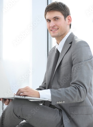 businessman talking on the Internet using a laptop