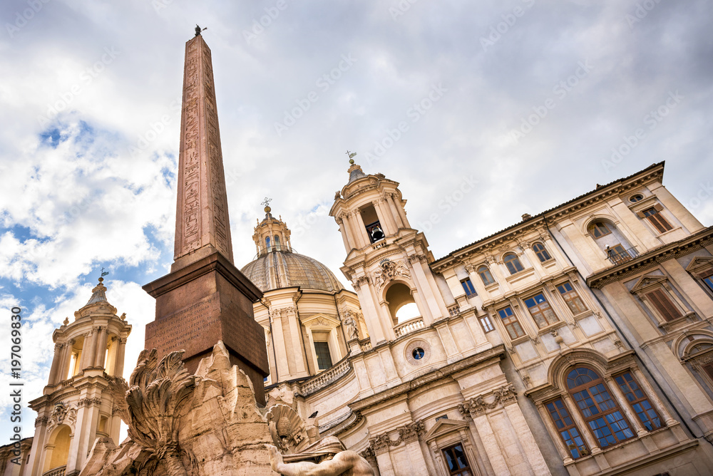 Rome - Church Sant Agnese in Agone and Fountain of the four Rivers with Egyptian obelisk on Piazza Navona in Rome, Ital Rome - Church Sant Agnese in Agone and Fountain of the four Rivers with Egyptian obelisk on Piazza Navona in Rome, Ital