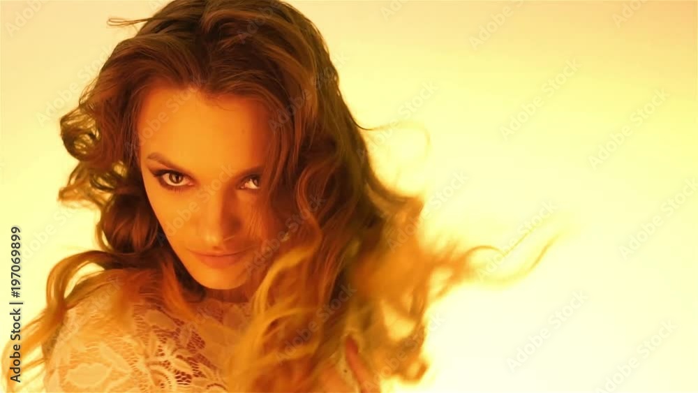 young brown hair girl in warm yellow lights posing young brown hair girl in warm yellow lights posing