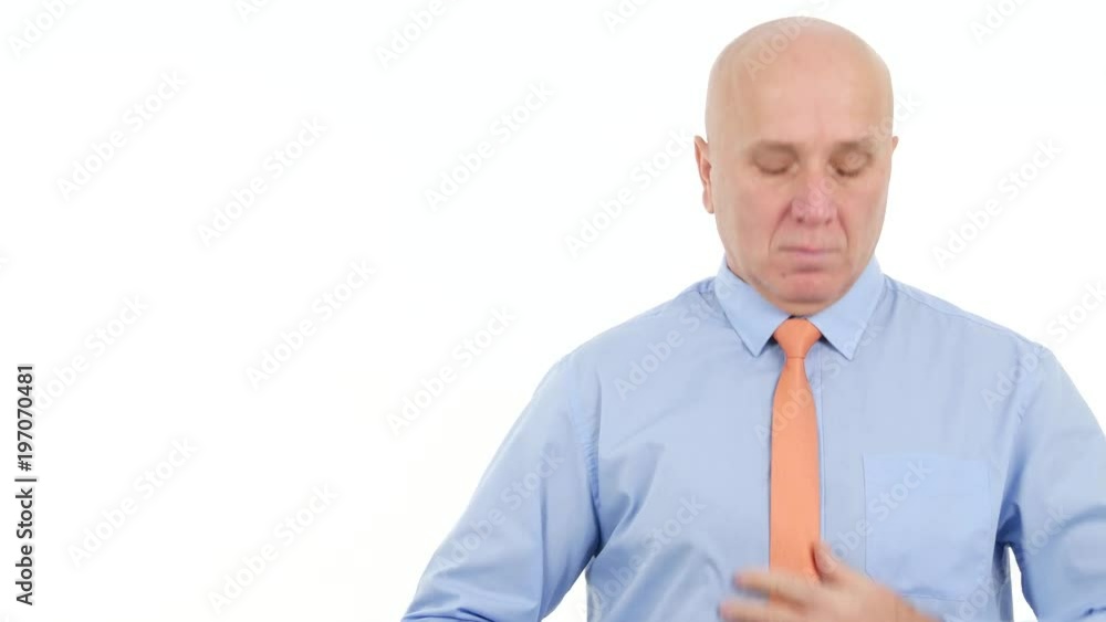 Serious Businessman Arranges His Tie Serious Businessman Arranges His Tie